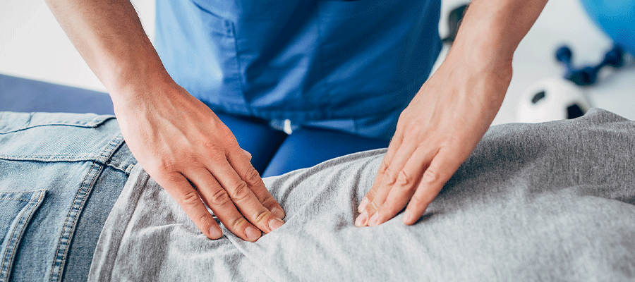 Chiropractor in Tulsa, OK providing chiropractic care to a patient.