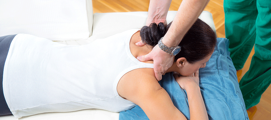 Woman laying down receiving Chiropractic Care